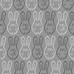 Children drawing rabbits hand drawn wax crayons art on grey.Chalk Easter bunny background.  Crayon style funny bunny backdrop. Color oil pastel crayons freehand drawn rabbits. Fabric Easter texture.
