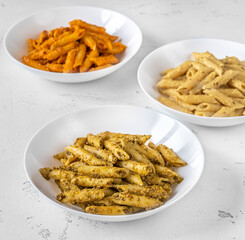 Penne pasta with various pesto sauces