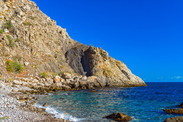 Fototapeta na wymiar beautiful sea bay among the rocks on a sunny summer day