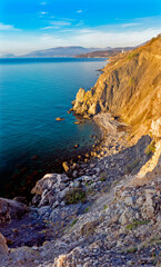 Fototapeta na wymiar beautiful sea bay among the rocks on a sunny summer morning