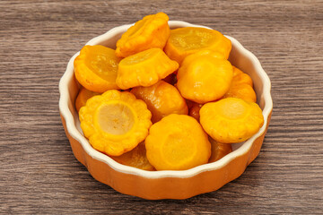 Marinated yellow patisson in the bowl