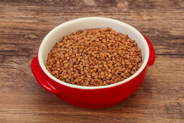 Raw buсkwheat cereal in the bowl