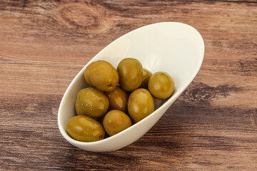 Green pickled olives in the bowl