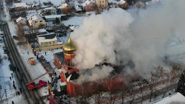 Large-scale fire in the church from above. The building is on fire