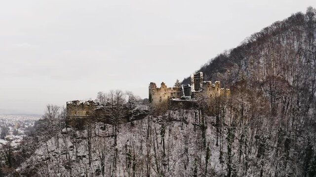 Aerial view of Samobor castle ruins covers by snow at sunset, Croatia.