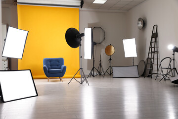 Fototapeta na wymiar Interior of modern photo studio with professional equipment