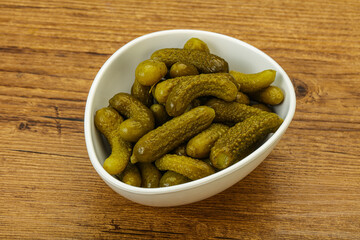 Pickled gherkin in the bowl