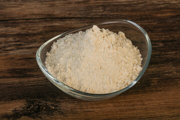 Wheat flour heap in the bowl