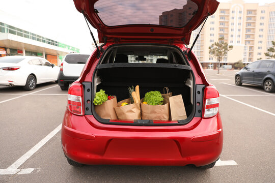 Bags Full Of Groceries In Car Trunk Outdoors