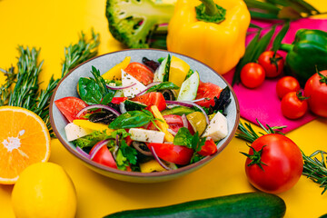 healthy food. Greek Salad with cheese, cucumbers, tomatoes and olives on a decorated table