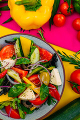 healthy food. Greek Salad with cheese, cucumbers, tomatoes and olives on a decorated table