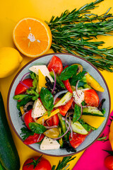 healthy food. Greek Salad with cheese, cucumbers, tomatoes and olives on a decorated table