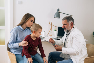 young boy with his mother visit pediatrician