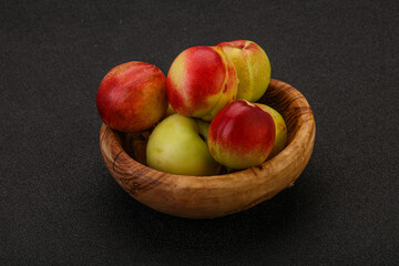 Sweet small nectarines in the basket