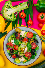 healthy food. Greek Salad with cheese, cucumbers, tomatoes and olives on a decorated table