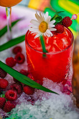 tropical cocktail with berries and fruits on a decorated table