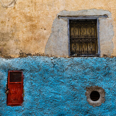 A wall detail with different windows, Morrocco