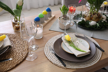 Beautiful Easter table setting with beautiful flowers indoors