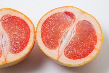 Grapefruit on a white background. A grapefruit cut in half. Citrus fruit. Exotic fruit