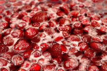 Cooking strawberry jam close up.