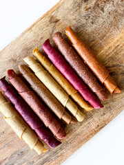 Fruit leather roll, pastille isolated on white background. Healthy snack food, natural nutrition for kids.