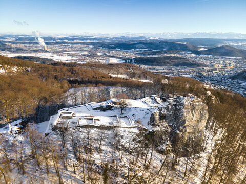 aerial view of winter landscape and swiss alps in the background, in the middle is the castle of Froburg in the canton of Aargau in Switzerland.