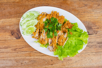Fried chicken pieces on a white plate 