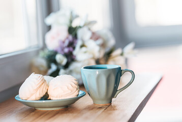Coffee drink with marshmellow on window in morning