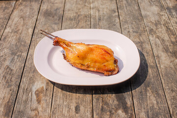 Grilled chicken wings on a wooden table