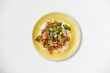 Spicy stir fried boar  on a yellow plate