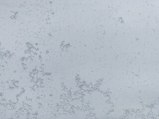 Close Up Winter Ice and Snow Sticking to Glass Window