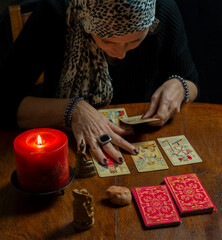 A fortune teller reads the tarot cards to predict the future