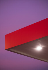 Abstract, minimalistic gas station and pink sunset