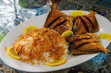 Traditional Arabic mixed rice and grilled fish