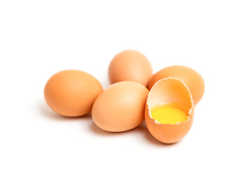 Focus fresh egg yolk in the shell on isolate white background.