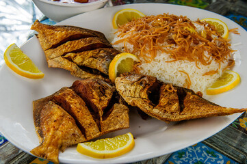 Traditional Arabic mixed rice and grilled fish