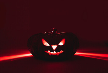 Happy Halloween with pumpkins made into Jack o'latern red light.