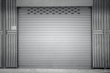 Closed steel shutter door of warehouse, storage or storefront for background and textured.