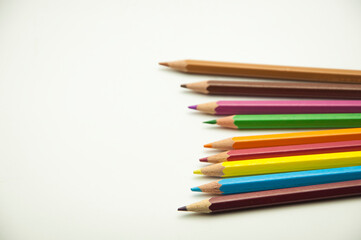 colored pencils on a white background. education concept. illustration of training.