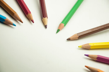 colored pencils on a white background. education concept. illustration of training.