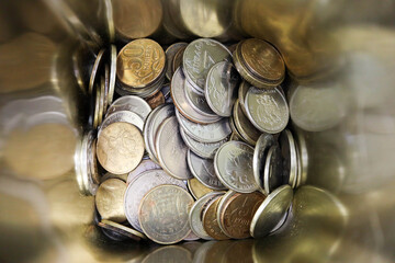 metal money box full of russian coins close up