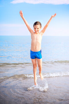 Smiling Boy On The Beach