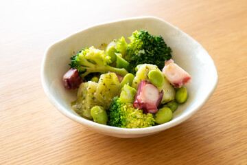 Octopus, broccoli, edamame, potato salad with basil sauce