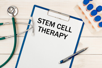 Paper with STEM CELL THERAPY on a table, stethoscope and pen