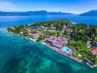 View by Drone - Aquaria in Sirmione, Garda Lake. spectacular view on lake, italian summer view...