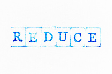 Blue color ink rubber stamp in word reduce on white paper background
