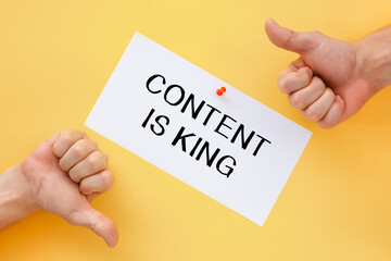 Male hands show signs of approval or disapproval. Postcard with the inscription CONTENT IS KING