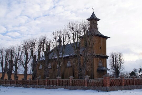 the 19th-century wooden church of Saint Leonard in Chociszewo, Poland in winter