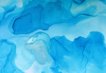 Abstract blue background, wallpaper. Mixing acrylic paints. Modern art. Marble texture. Alcohol ink colors translucent