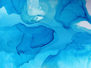 Abstract blue background, wallpaper. Mixing acrylic paints. Modern art. Marble texture. Alcohol ink...